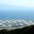 錦江湾に浮かぶ世界最大級の石油基地。対岸には火山・桜島がかすんでいる