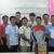 洗車キャンペーンの益金を寄付する青年部会のメンバー（沖縄県石油会館で、嘉手川会長は前列右端）