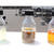 廃食油（右）とユーグレナ油脂（中）から作られた無色透明な「サステオ」（左）
