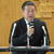 記者会見に応じた吉田新理事長
